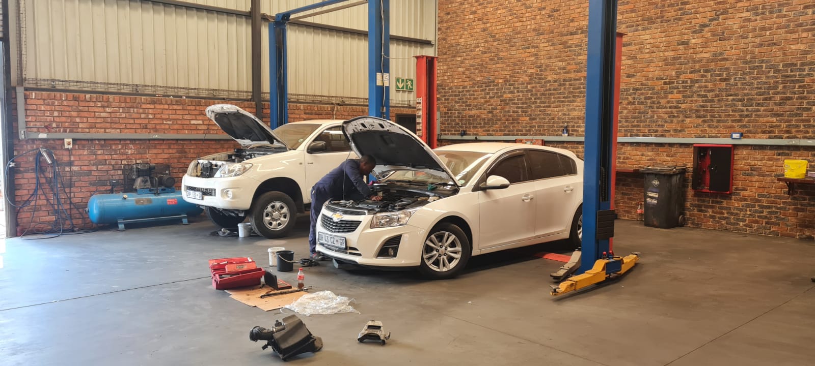 car mechanic working on car