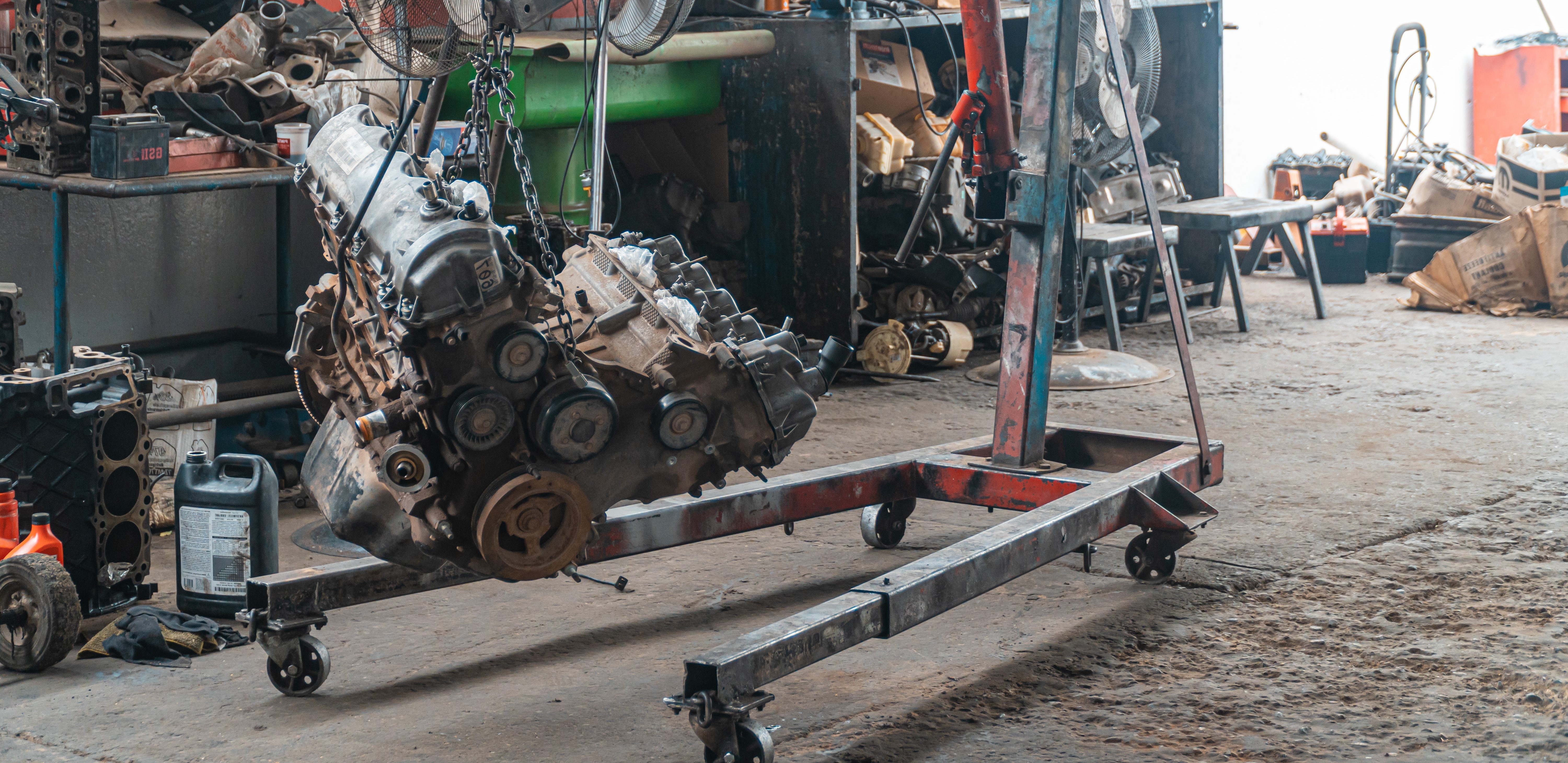 car engine hanging on a machine